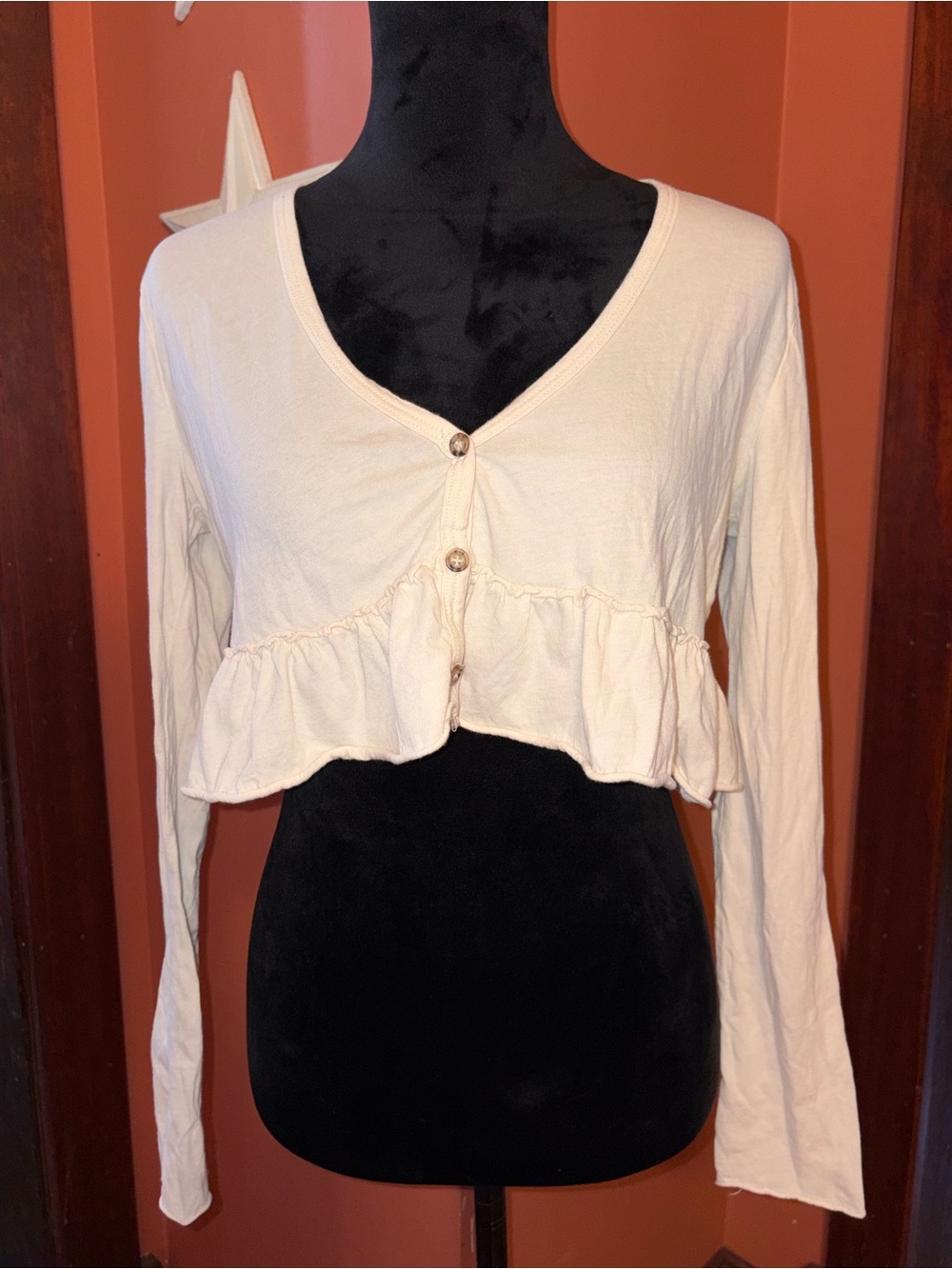 Project Social T-Urban OutfittersCream Ruffle-Hem Cropped Button Long Sleeve Top